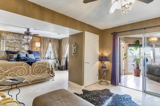 4552 Bayside Dr, Milton, FL 32583 - bedroom with light tile patterned floors, a ceiling fan, baseboards, and access to outside