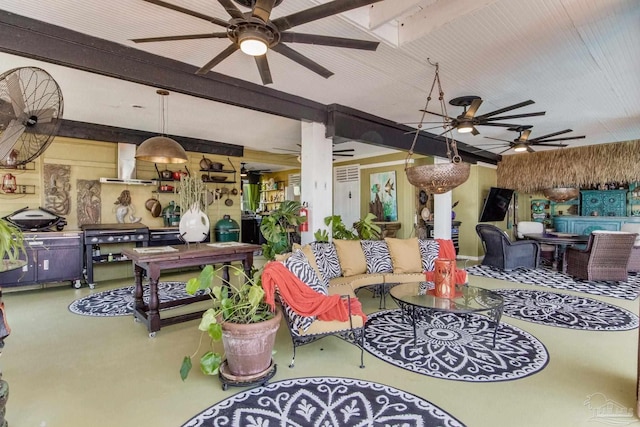 4552 Bayside Dr, Milton, FL 32583 - living area featuring beamed ceiling, finished concrete flooring, wood walls, and ceiling fan