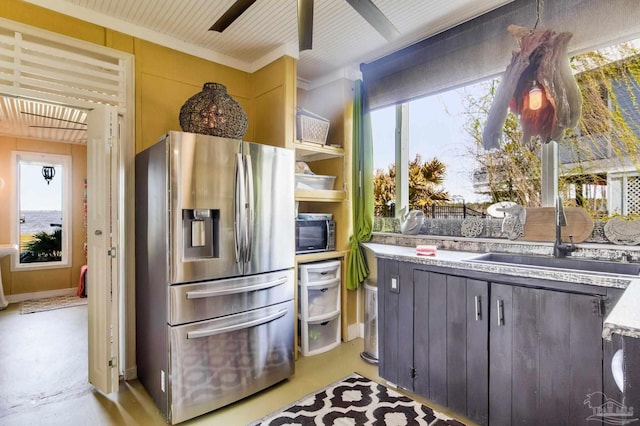 4552 Bayside Dr, Milton, FL 32583 - kitchen with open shelves, a sink, ceiling fan, light countertops, and stainless steel fridge