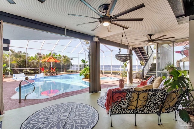 4552 Bayside Dr, Milton, FL 32583 - pool featuring glass enclosure, a ceiling fan, stairs, and a patio area