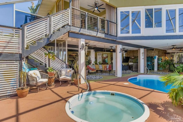4552 Bayside Dr, Milton, FL 32583 - pool with stairs, a patio, a ceiling fan, and an in ground hot tub