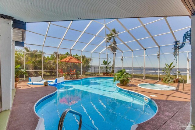4552 Bayside Dr, Milton, FL 32583 - view of swimming pool with glass enclosure, an in ground hot tub, and a patio area