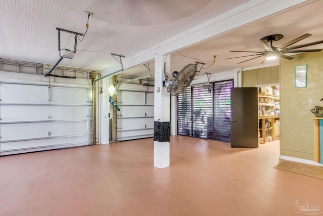 4552 Bayside Dr, Milton, FL 32583 - garage featuring a garage door opener and a ceiling fan