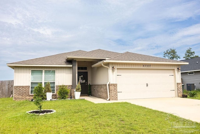 view of front of home featuring a front lawn and a garage