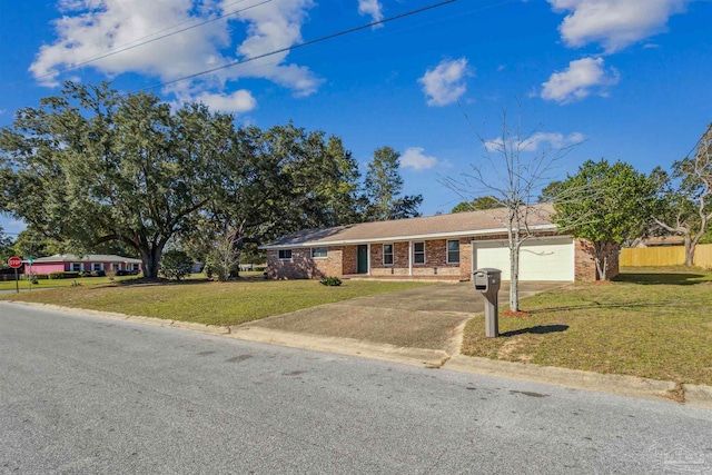 720 Lambert St, Pensacola, FL 32505 - single story home with a garage, fence, a front lawn, brick siding, and driveway