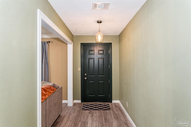 720 Lambert St, Pensacola, FL 32505 - foyer with light wood-type flooring, baseboards, and visible vents