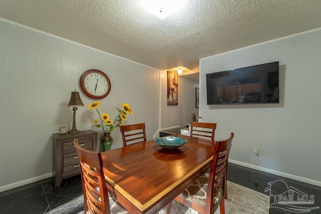 dining space featuring crown molding and a textured ceiling