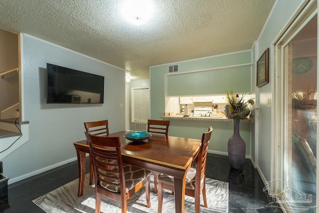 dining area with a textured ceiling