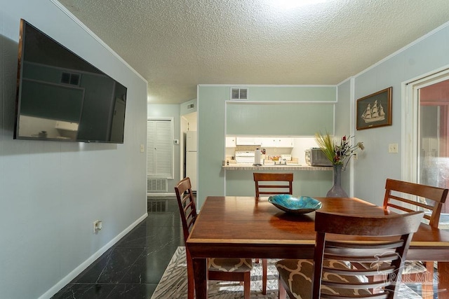 dining room with a textured ceiling