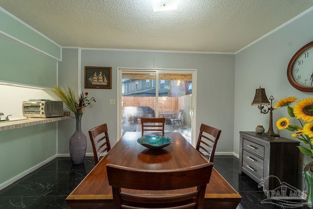 dining room with crown molding and a textured ceiling