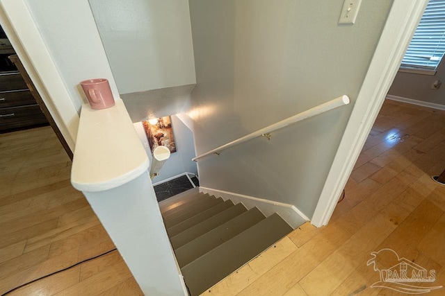 staircase featuring hardwood / wood-style flooring