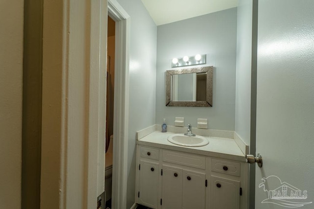 bathroom with vanity and toilet