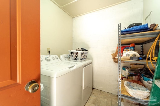 clothes washing area featuring separate washer and dryer