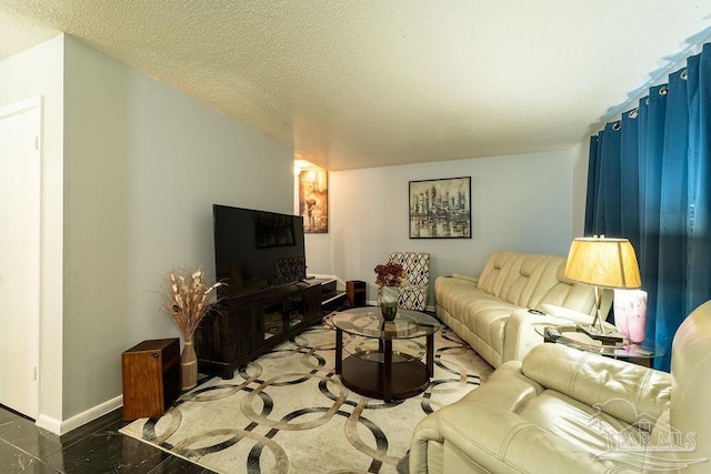 living room with a textured ceiling