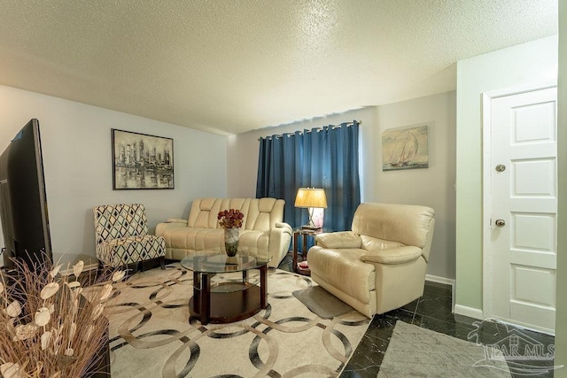 living room with a textured ceiling