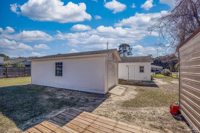 view of outbuilding with a yard and a garage