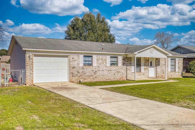 ranch-style home with a garage and a front lawn