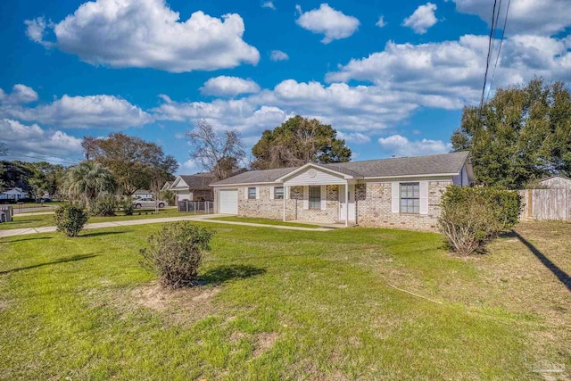 ranch-style home featuring a front lawn and a garage