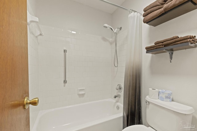 bathroom with shower / bath combo and toilet