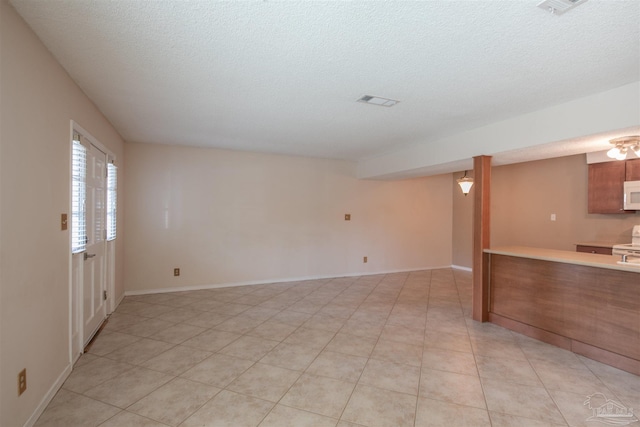 empty room featuring a textured ceiling