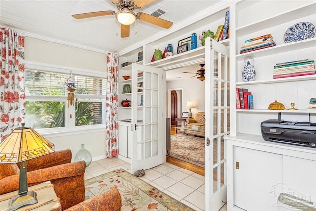 sitting room with tile patterned flooring, visible vents, a ceiling fan, and french doors