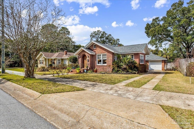 ranch-style home featuring brick siding, fence, a garage, driveway, and a front lawn