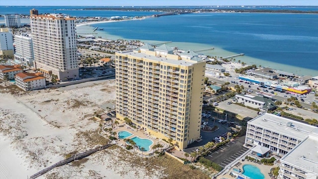 22 Via Deluna Dr Unit 604, Pensacola Beach, FL 32561 - drone / aerial view of a pool area, a nearby body of water, and apartment complex / building