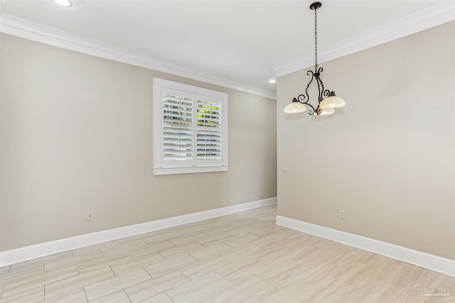 spare room featuring recessed lighting, a notable chandelier, baseboards, and ornamental molding