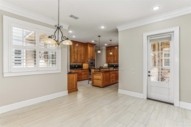 kitchen with dark countertops, brown cabinetry, baseboards, ornamental molding, and recessed lighting