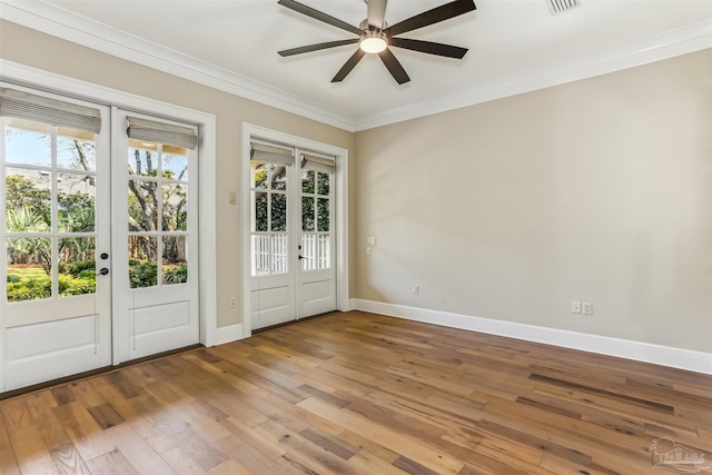 foyer featuring french doors, wood-type flooring, crown molding, baseboards, and ceiling fan