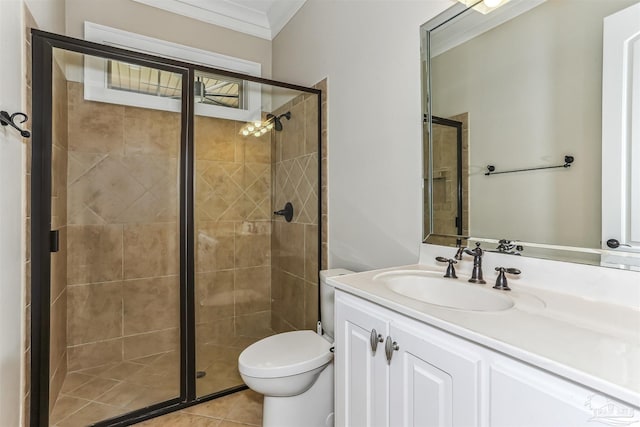 bathroom featuring a shower stall, tile patterned flooring, toilet, vanity, and crown molding
