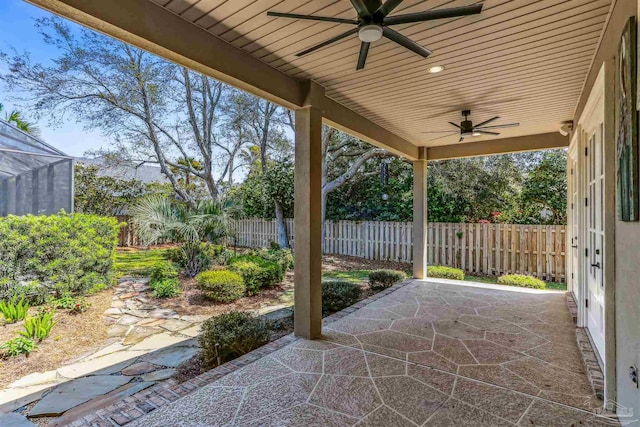 view of patio with a fenced backyard and a ceiling fan