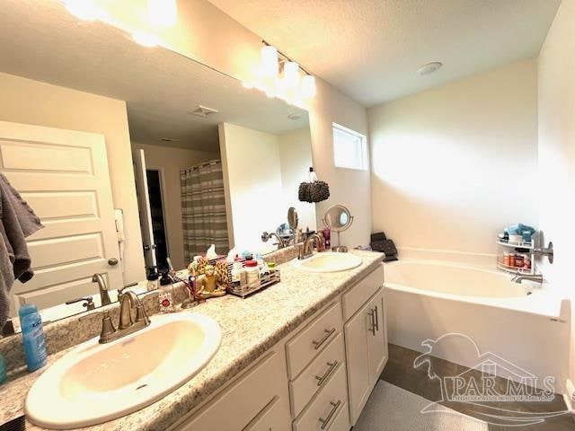 bathroom featuring independent shower and bath and vanity