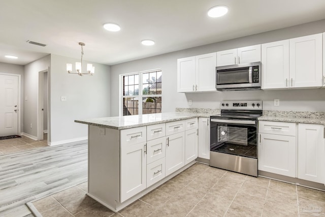 kitchen featuring white cabinetry, hanging light fixtures, stainless steel appliances, light stone countertops, and kitchen peninsula