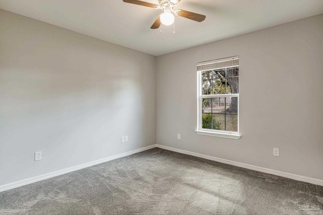 empty room featuring carpet floors and ceiling fan