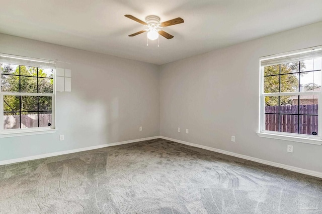 empty room with carpet floors and ceiling fan