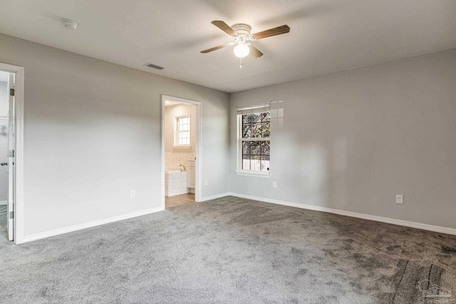 carpeted empty room with ceiling fan