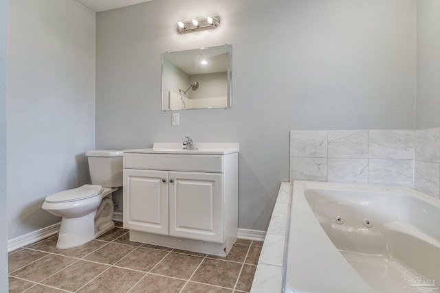 bathroom featuring vanity, tile patterned floors, a bathtub, and toilet