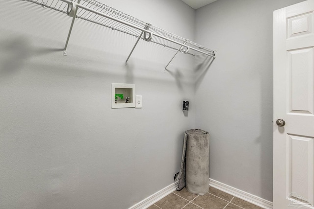 laundry room featuring hookup for an electric dryer, washer hookup, and tile patterned floors