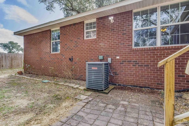 view of home's exterior featuring a patio area and central air condition unit