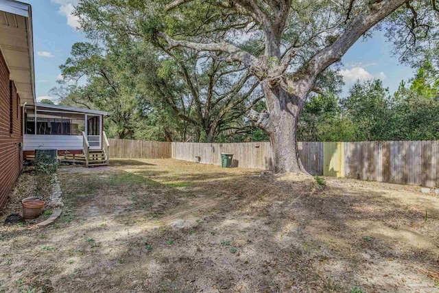 view of yard with a sunroom