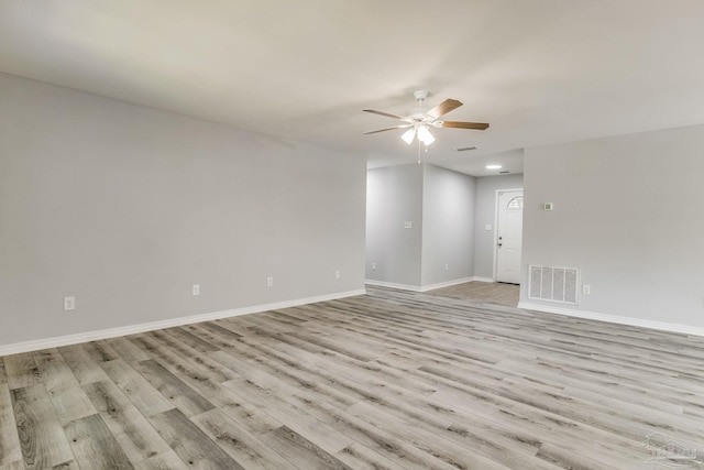 spare room featuring ceiling fan and light wood-type flooring