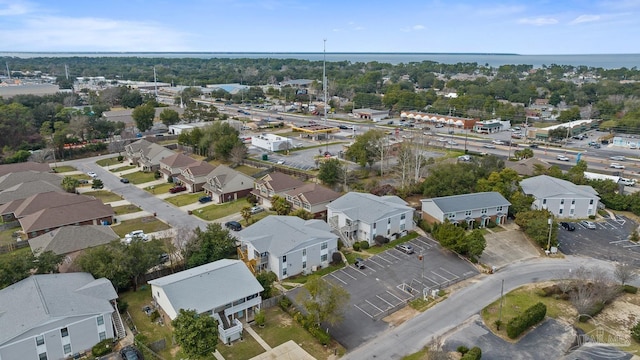 bird's eye view featuring a water view and a residential view