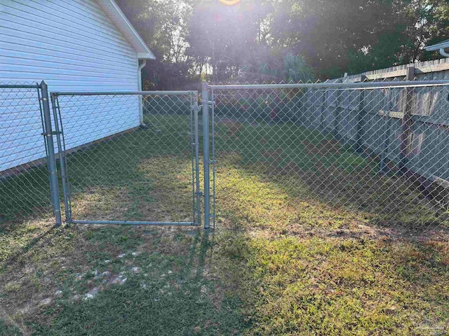 view of yard featuring a gate and fence