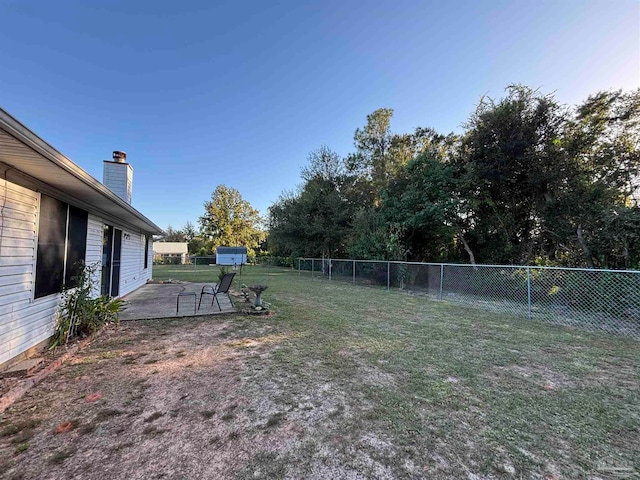 view of yard with a fenced backyard and a patio