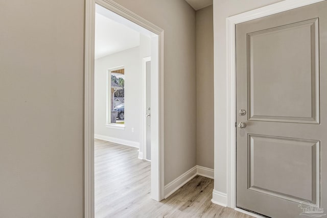 hall with light hardwood / wood-style floors