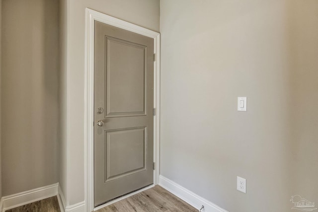 doorway to outside with light wood-type flooring