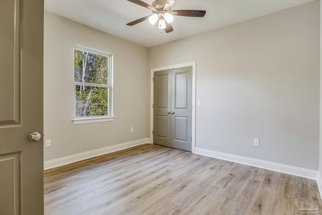 unfurnished room with ceiling fan and light hardwood / wood-style flooring