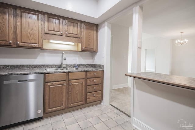 kitchen featuring sink, dishwasher, light tile patterned flooring, decorative light fixtures, and a chandelier