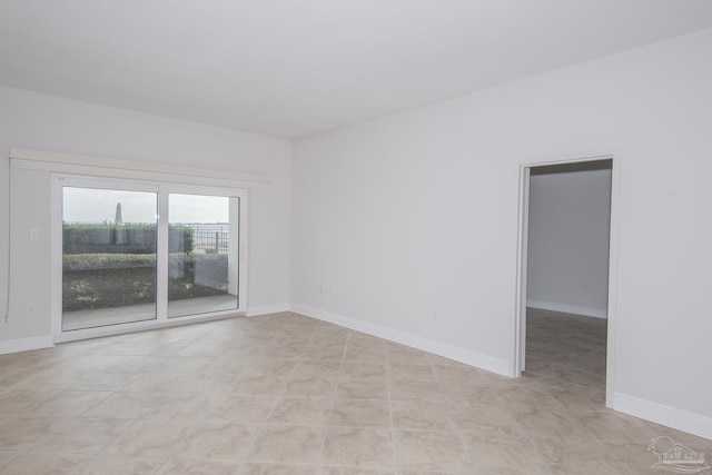 empty room featuring light tile patterned floors